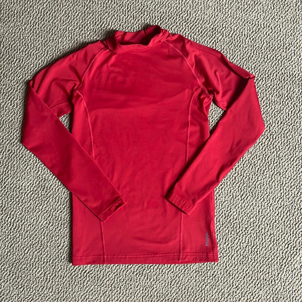 Reebok “Play Warm” long sleeve red top. Size XL (18 - 20)